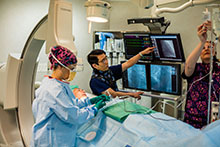 Chin Lim in CCL explaining procedure to patient